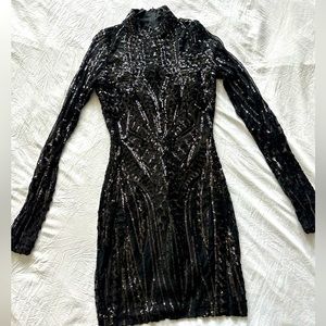 Beautiful black mini dress with sequins.